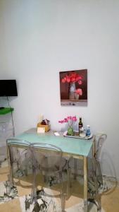 A television and/or entertainment centre at Michelangelo al Duomo - Bufalini Apartments