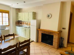 Η κουζίνα ή μικρή κουζίνα στο Apartamentos Margarita