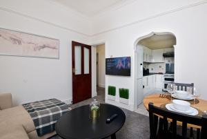 a living room with a couch and a table at Liverpool City Stays - Economy Room Close to city centre GG in Liverpool
