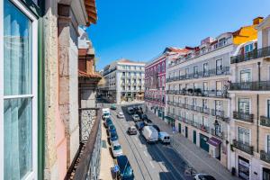 a view of a city street with cars and buildings at Chiado Prime Camões Apartment in Lisbon