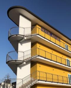 a building with balconies on the side of it at Hotel Alverì in Mestre