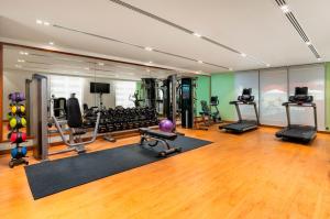 a gym with several treadmills and exercise equipment at Holiday Inn & Suites Al Jubail, an IHG Hotel in Al Jubail