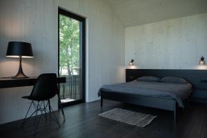 Ένα ή περισσότερα κρεβάτια σε δωμάτιο στο MAAJO Boutique Hotel