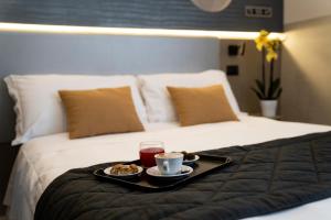 Postel nebo postele na pokoji v ubytování Hotel Plaza