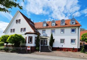 a large white house with a red roof at Häuser der Villa Italia in Marktheidenfeld