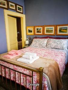 a bedroom with a bed with two towels on it at Exclusive Ca Quadri Apartments in Venice