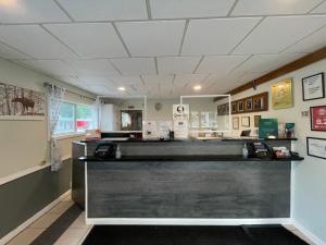 a barber shop with a black counter in a room at Quality Inn & Suites in Lincoln