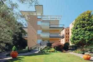 a tall building with a staircase in a yard at Grand Central Room in Bologna