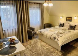 Posteľ alebo postele v izbe v ubytovaní Apartamenty u Magika
