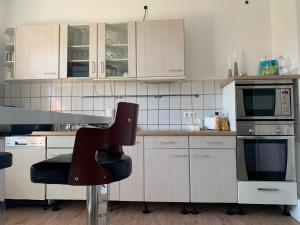 a kitchen with a table and a chair in it at Etage1 in Hameln