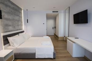 Postel nebo postele na pokoji v ubytování Mirage Hotel