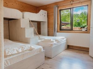 A bed or beds in a room at River Residence Chalet