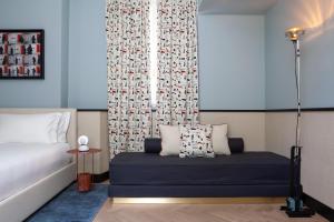 Postel nebo postele na pokoji v ubytování Amabilia Suites