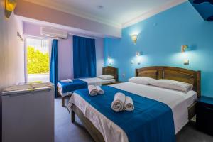 Cama o camas de una habitación en Selim Pansiyon
