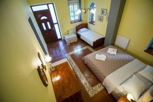 an overhead view of a bedroom with a bed and a living room at Oasis in Preveza