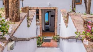 a house with a pathway leading to the front door at Albergo Diffuso Bacco Furore in Furore