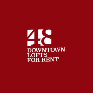a red sign with the number for rent at 48 Downtown Lofts in Néa Péramos