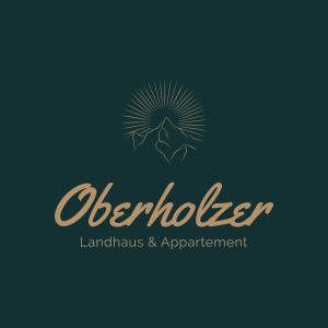 un logo per uno studio legale con un mandala di Oberholzer Landhaus & Appartement a Ellmau