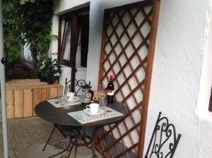 a table and chairs sitting on a patio at Oberholzer Landhaus & Appartement in Ellmau