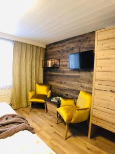Łóżko lub łóżka w pokoju w obiekcie Hotel Alpenblick