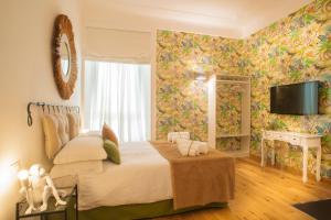 Ένα ή περισσότερα κρεβάτια σε δωμάτιο στο La Casa delle Tartarughe