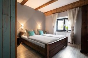 Säng eller sängar i ett rum på Penzion Kolovna