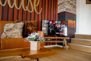 a living room with a couch and a table at See-Charme in Uhldingen-Mühlhofen