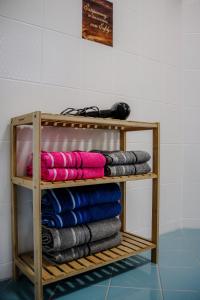 a wooden shelf with towels on it in a room at See-Charme in Uhldingen-Mühlhofen +32 photos