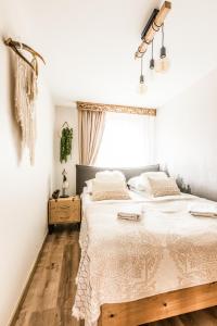 Posteľ alebo postele v izbe v ubytovaní Apartament Diamentowy Odkryj Zakopane