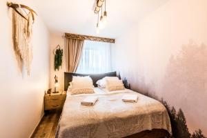 Posteľ alebo postele v izbe v ubytovaní Apartament Diamentowy Odkryj Zakopane