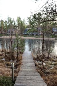 a wooden path next to a body of water at Rantatähti in Kalajoki