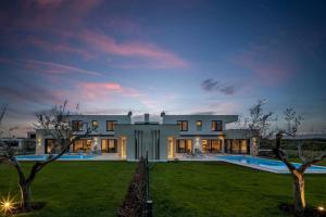 a large house with a yard and a pool at Villa Bella by SeeAdria Agency in Brtonigla