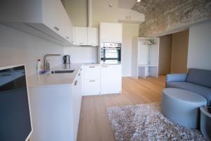 Kuchyň nebo kuchyňský kout v ubytování Baltic Accommodation - Urban Style Apartment
