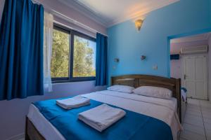 Cama o camas de una habitación en Selim Pansiyon