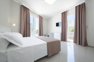 Postel nebo postele na pokoji v ubytování Smart Hotel Ugento