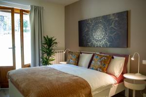 A bed or beds in a room at Villa Giuliana B&B
