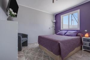 Giường trong phòng chung tại Villa Encanto Fuerteventura