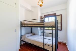 A bed or beds in a room at La Pontezuela Alanis