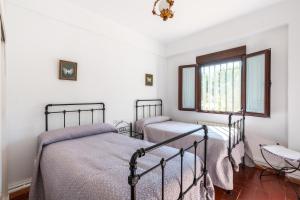 A bed or beds in a room at La Pontezuela Alanis