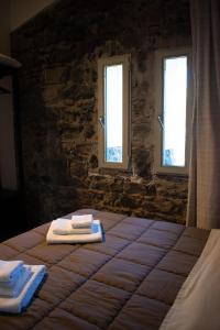 A bed or beds in a room at Ghè House