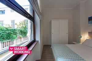 A bed or beds in a room at Genova XXV Aprile by Wonderful Italy