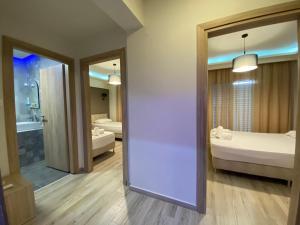 Postel nebo postele na pokoji v ubytování Nikolaidis Apartments