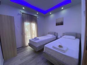 Postel nebo postele na pokoji v ubytování Nikolaidis Apartments