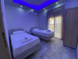 Postel nebo postele na pokoji v ubytování Nikolaidis Apartments