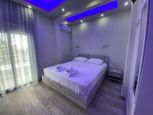Postel nebo postele na pokoji v ubytování Nikolaidis Apartments
