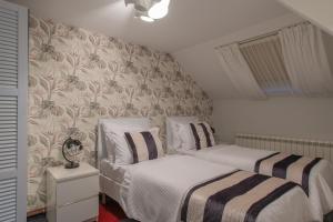 Letto o letti in una camera di Apartmani Maximilian