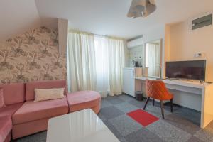 TV a/nebo společenská místnost v ubytování Apartmani Maximilian