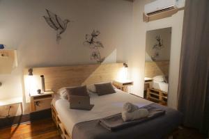 Cama ou camas em um quarto em Hostel Boutique Merced 88