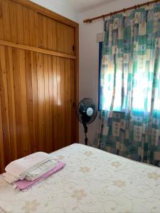 A bed or beds in a room at Apartamentos Carolina