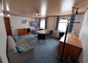a living room with a couch and a table at Smile Hotel in Nuremberg